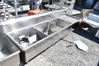 TSB-3-R2 commercial 3 bay sink with right side drain boards, no legs, in used condition, stainless steel construction.