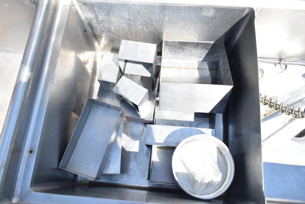 TSB-3-R2 Commercial 3 Bay Sink with right side drain boards shown without legs, featuring stainless steel finish and visible wear.