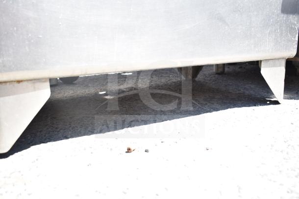 Commercial single bay sink without legs, stainless steel, suitable for industrial use. Visible scuffs, no additional features.