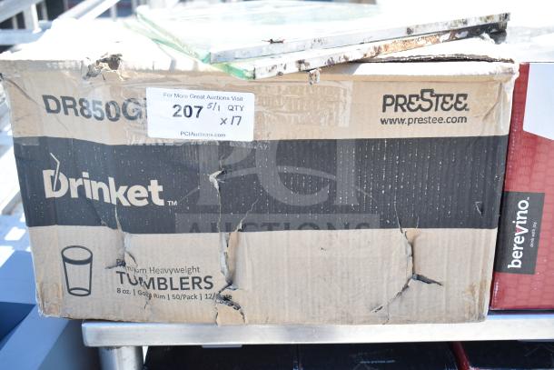 Box of Drinket 8 oz tumblers and Berevino stemless wine glasses, visible wear, auction tag reads "207 x17".