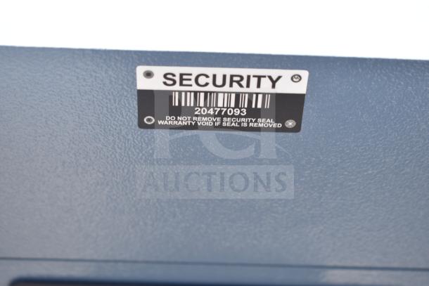 Gray metal unit with 3 compartments on commercial casters, features "SECURITY" label with barcode 20477093.