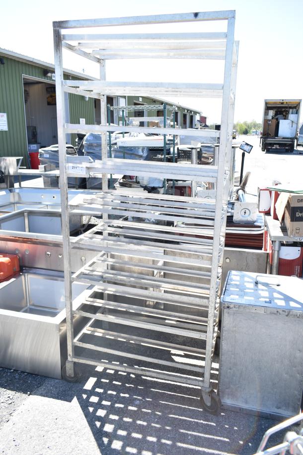 Commercial #10 Can Rack on casters; metal frame, multiple shelves, used condition, ideal for kitchen storage.