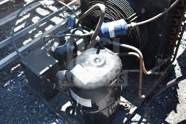 Kulthorn AW 2610Z-2 compressor, 208-230V, 1 phase, showing visible wear. Labels indicate model and specifications.