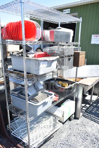 Chrome 5-tier wire shelving unit on casters with poly bins, bus bins, cooler racks. Buyer dismantles. Consider freight.