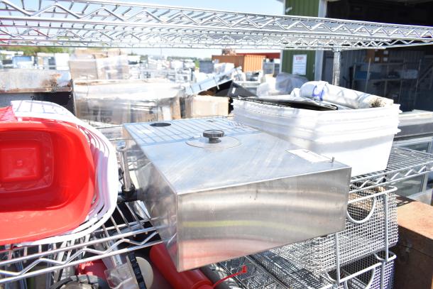 Chrome 5-tier wire shelving unit with commercial casters, includes poly bins, bus bins, and cooler racks; dismantling required.