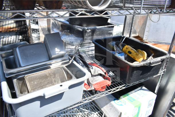 Chrome finish 5-tier wire shelving unit on casters, holding poly bins, bus bins, and cooler racks. Contents included.