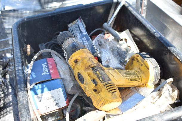 Chrome finish 5-tier wire shelving unit on casters with assorted tools and bins, including a yellow power drill.
