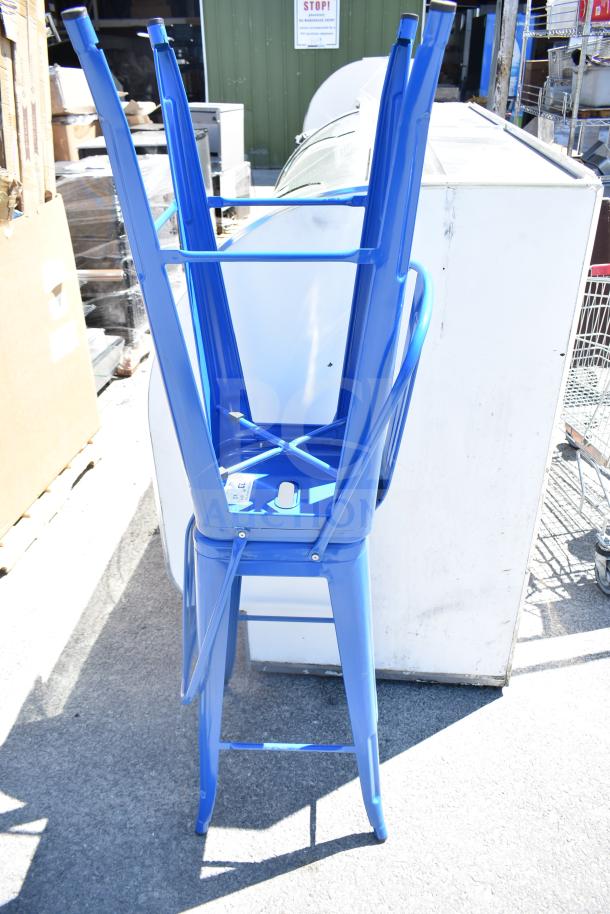 Two blue Tolix-style bar height chairs with glossy finish, in good condition. Sturdy metal frame, stackable design.