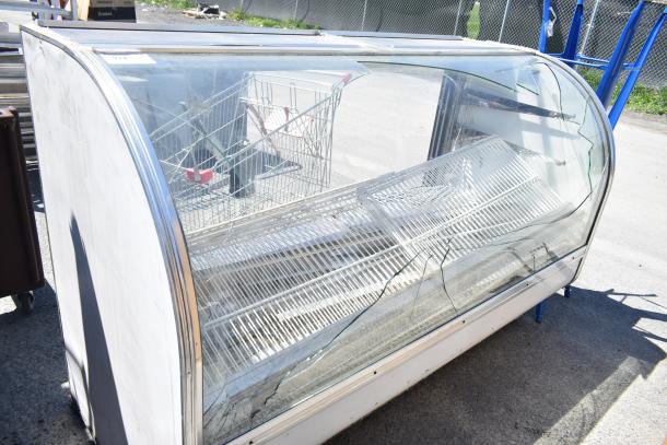 Leader MCB77 deli display case, glass-fronted, visible scratches, 115V, 1 phase, commercial style.