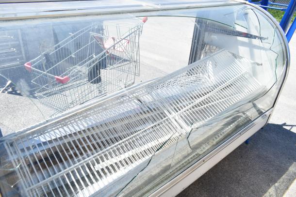 Leader MCB77 commercial deli display case, floor style. Notable glass damage, 115V, 1 phase, used condition.