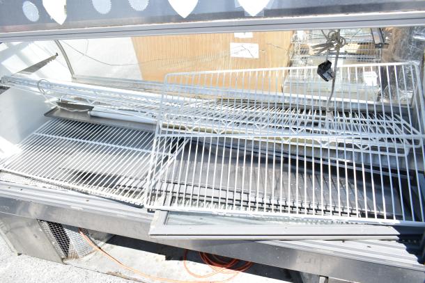 Leader MCB77 deli display case, floor style, 115 volts, 1 phase, features glass front, wire racks, moderate wear.