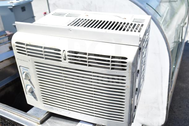 Frigidaire FAX052P7A window air conditioner, 115 volts, used condition, visible controls, slight wear.