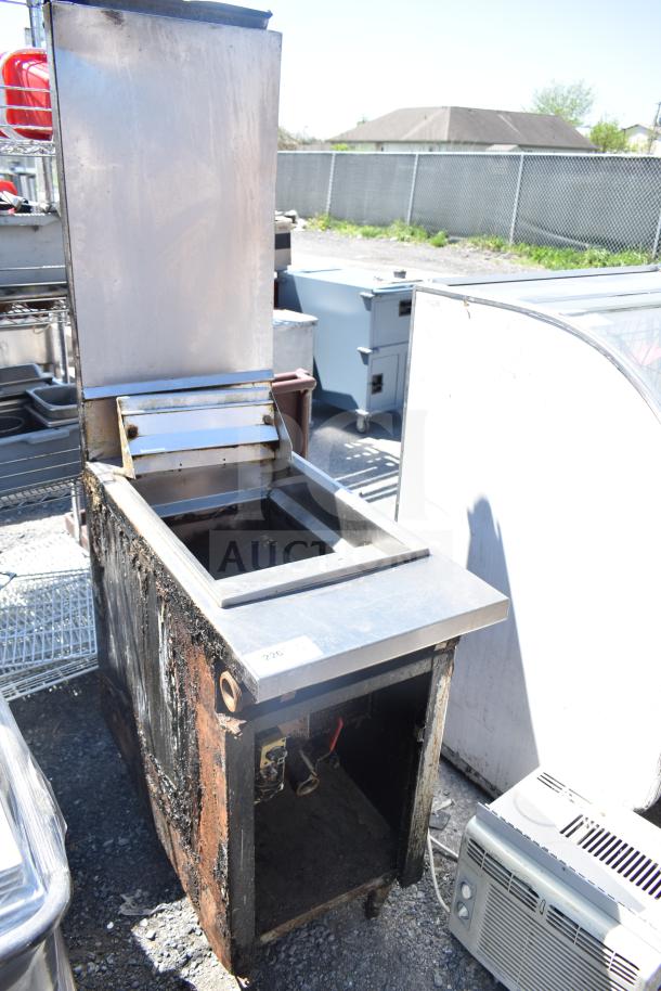 Frymaster J2XLRSP commercial deep fat fryer, natural gas powered, floor style, visible wear and rust, model tag visible.