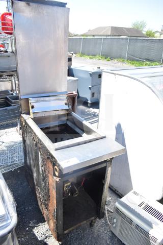 Frymaster J2XLRSP commercial deep fat fryer, natural gas powered, floor style, visible wear and rust, model tag visible.