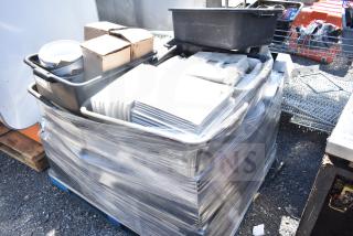 Pallet lot with square plates, bowls, and assorted items wrapped in plastic, various conditions, ready for auction.