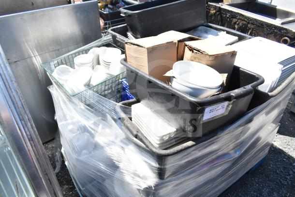 Pallet of various items including stackable white square plates, bowls in plastic bins; some items boxed, all shrink-wrapped.