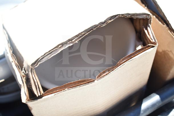 Pallet lot featuring boxed square plates and bowls, partially visible, condition appears new.