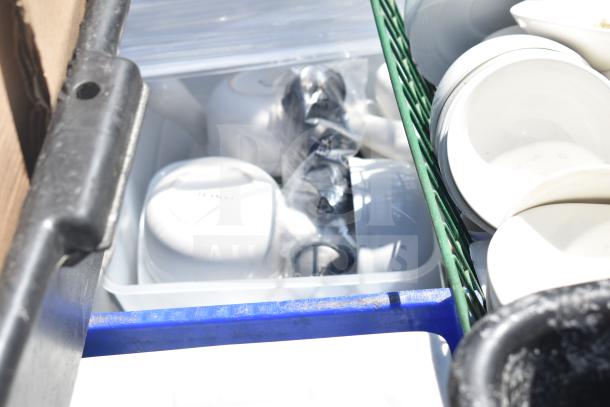 Pallet of various items including white square plates and bowls, some in plastic wrap, stored in crates.