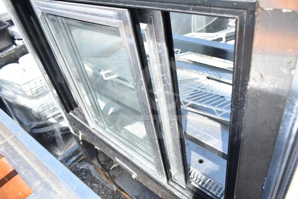 Leader CVK48 S/C deli display case, commercial floor style, 115 volts, 1 phase, glass doors, interior shelving, used condition.