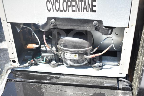 Four mini coolers including Frigidaire, Arctic Air, Accucold. 115 volts, 1 phase. Cyclopentane insulation visible.