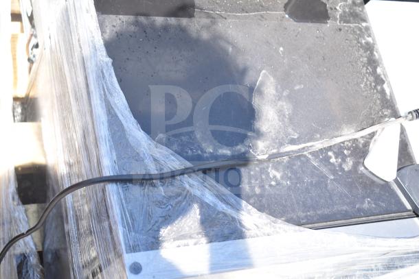 Four mini coolers, brands include Frigidaire, Arctic Air, Accucold, 115 volts, 1 phase, wrapped for auction.