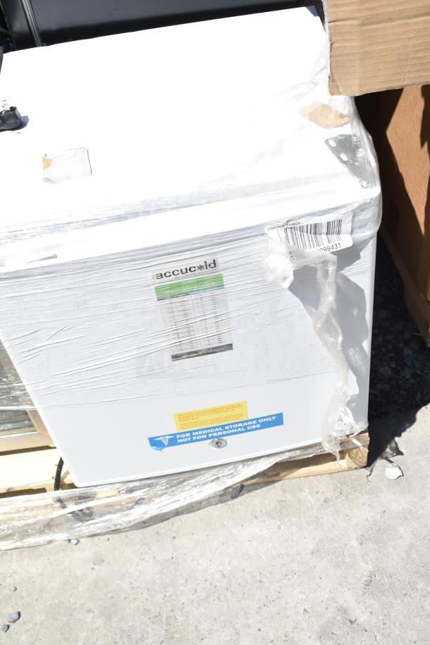 4 mini fridges, including Accucold, for auction. 115 volts, 1 phase. Wrapped on pallet. "For medical storage only" label.