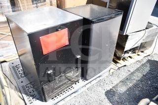 Two mini coolers, 115 volts, 1 phase, black metal exterior, one with red panel, moderate wear, auction item.
