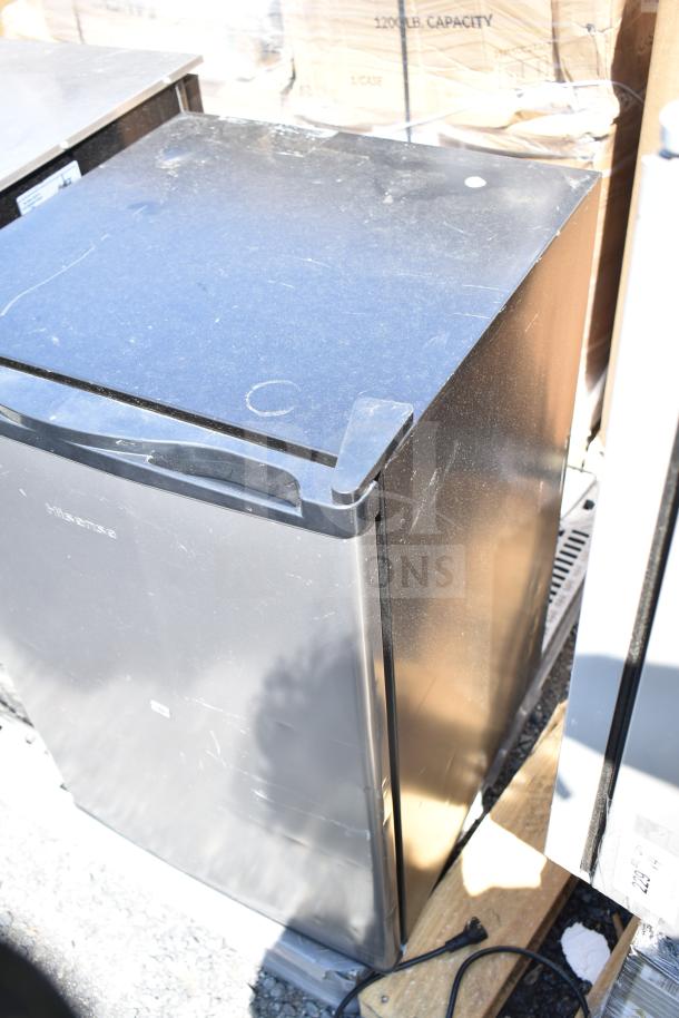 Two black mini coolers, 115 volts, 1 phase, in fair condition, scuffs visible. Hisense branding on the door.