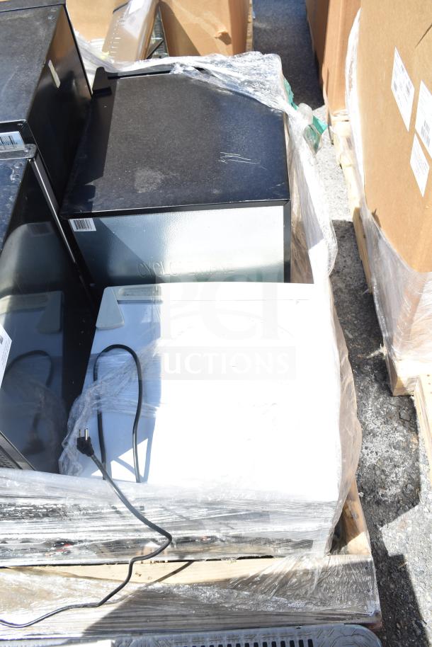 Four mini coolers including Black & Decker, EdgeStar; 115 volts, 1 phase; shown packaged on a pallet; auction item.