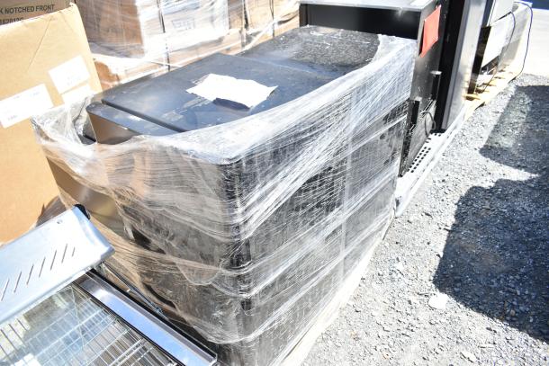 Four mini coolers, including Black & Decker and EdgeStar, wrapped in plastic on a pallet. 115 volts, 1 phase.