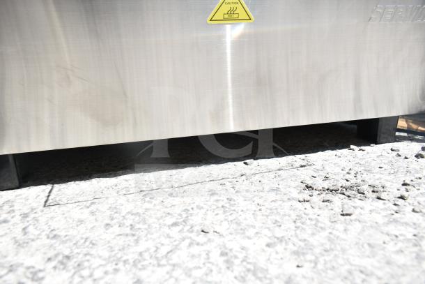 ServIt 423HDM26SA 26" heated display case, stainless finish, caution label, visible scratches, 120V, 1 Phase.