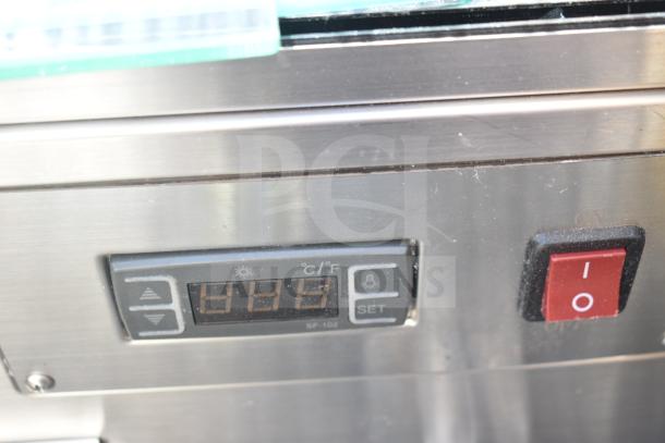 Control panel of a ServIt 423HDM26SA heated display case with temperature and power settings.