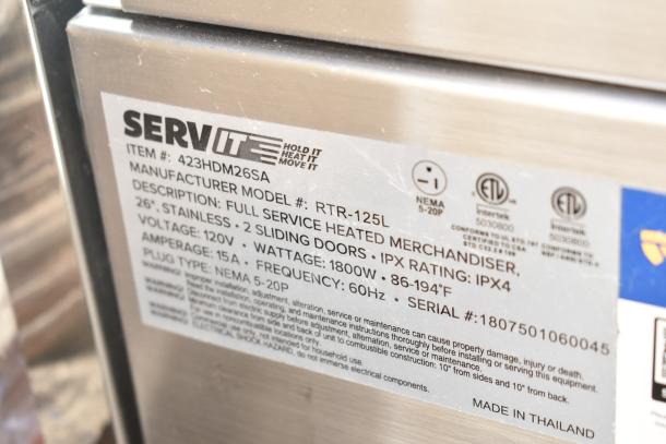ServIt 423HDM26SA 26" heated display case, stainless steel, 3 shelves, sliding doors, 120V, NEMA 5-20P plug, new condition.