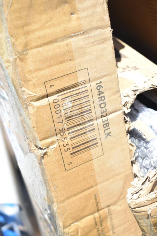 Damaged cardboard box with barcode and model number 164RD323BLK. Contains ServIt 423HDM26SA items including chairs and tables.