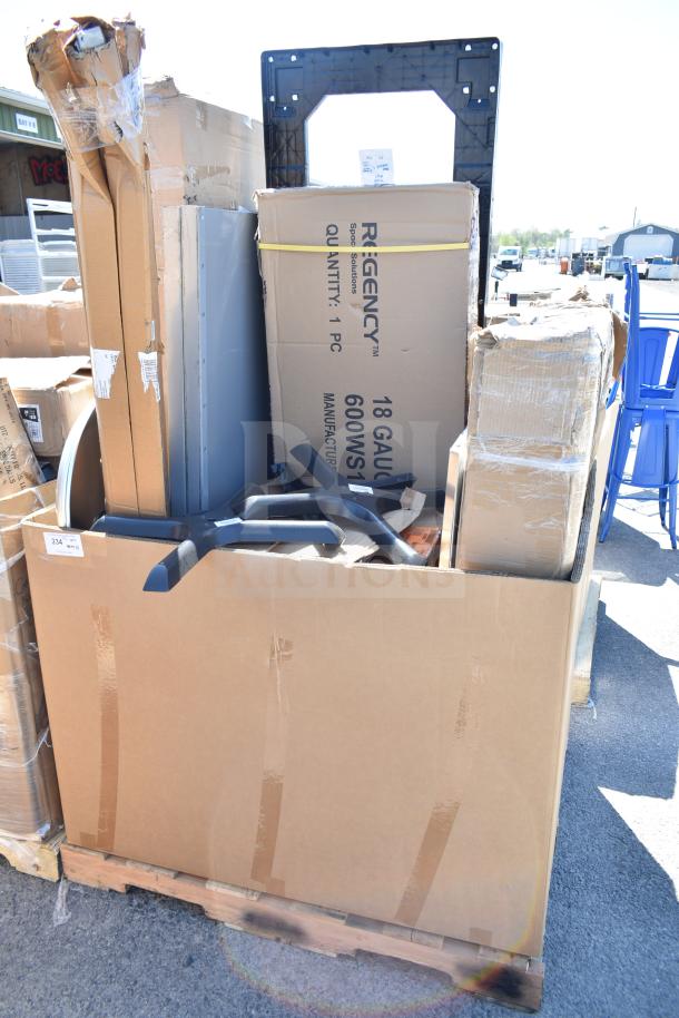 Box containing 14 new ServIt 423HDM26SA scratch and dent items, including wall corner guard, work table, dolly visible.