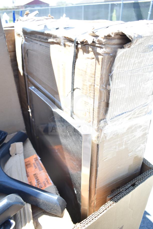 14 new scratch and dent items including a ServIt model 423HDM26SA wall corner guard, work table, dolly. Damaged packaging.