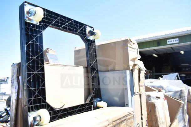 ServIt dolly Model 423HDM26SA, new scratch and dent, with swivel casters on boxes near warehouse.