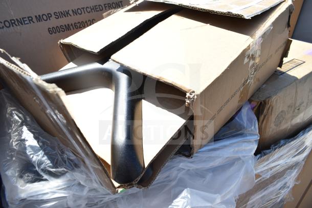 15 brand new scratch and dent items including ServIt 423HDM26SA mop sink in boxes. Visible corner mop sink notched front.