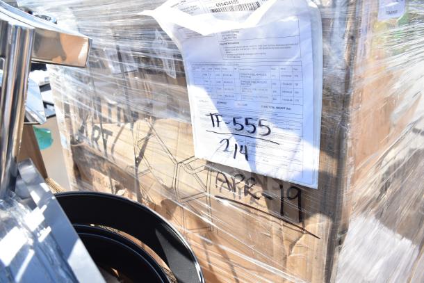 Pallet with wrapped utility cart and sinks, marked as new scratch and dent items. Visible labels show "TT-555 214" and "APR-19".