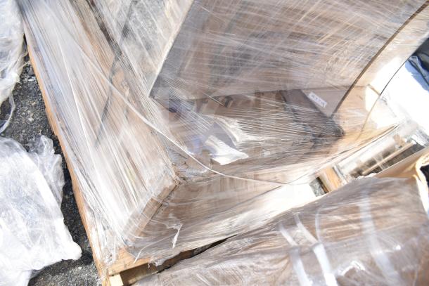 Pallet with 3 new scratch and dent items, including a utility cart and sinks, wrapped in plastic. Auction tag visible.