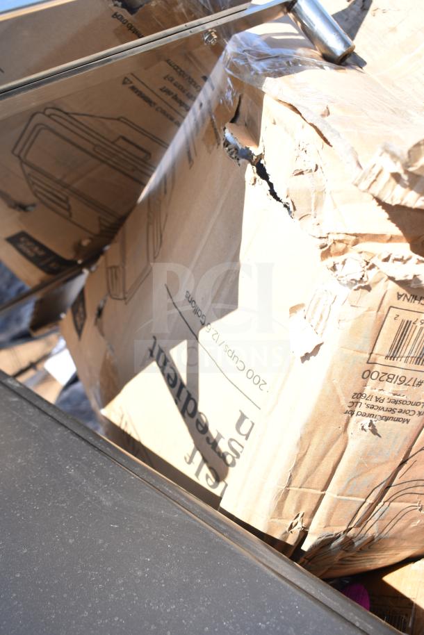 Damaged cardboard box labeled "200 cups/12 gallons," showing signs of wear. Contains new scratch and dent items.