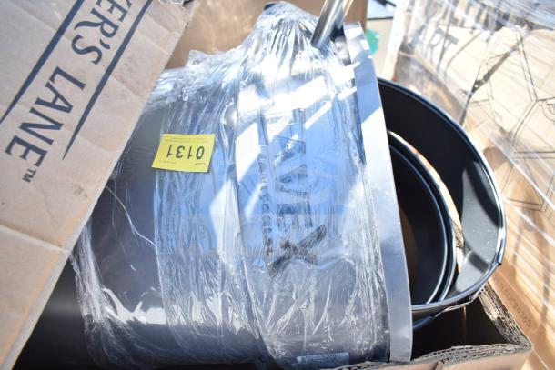 Brand new scratch and dent lot with trash cans and ingredient bins. Items wrapped in plastic with tag marked "Lot 0131".