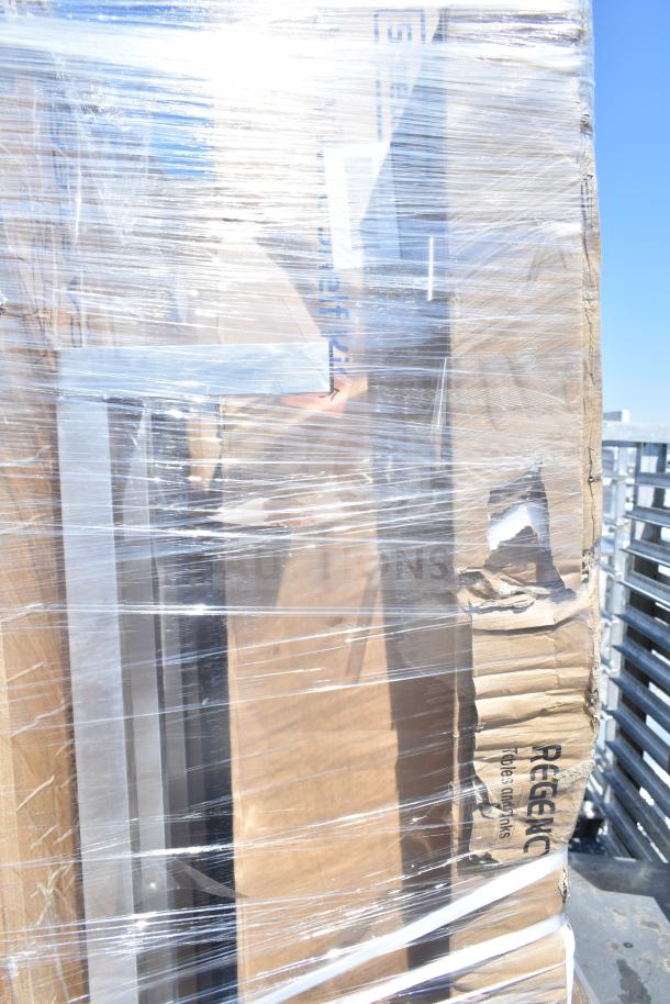 Pallet of 12 brand new scratch and dent items wrapped in plastic, including a dunnage rack and shelf kit, visible Regency label on box.