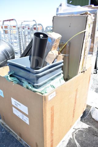 Large pallet box with mixed items, including bins, a high chair, and shelves. Marked “12 BRAND NEW SCRATCH AND DENT!”