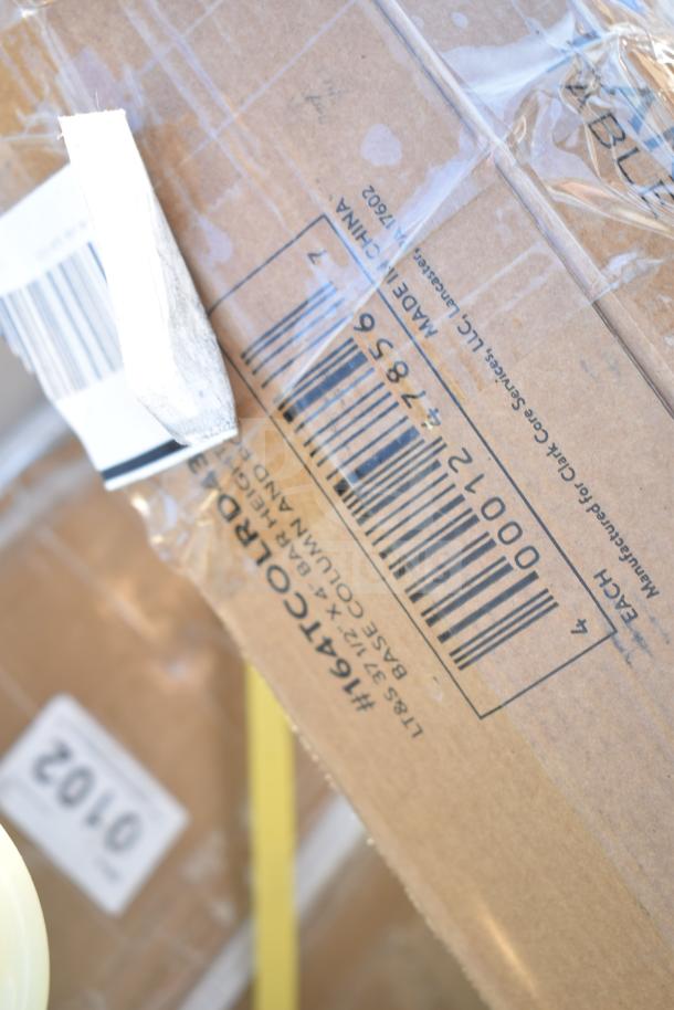 Cardboard box with shipping label and barcode for a lot of 12 new scratch and dent items including high chair and wall shelves.