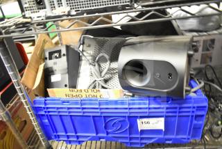 Auction lot with Vizio SV510XW-0906 subwoofer and Sensormatic ZBSMPROE antenna deactivator, packed in a blue crate.
