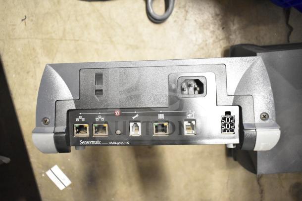 Sensormatic AMB-9010-IPS unit, showing five network ports and power connector. Part of auctioned lot with subwoofer.