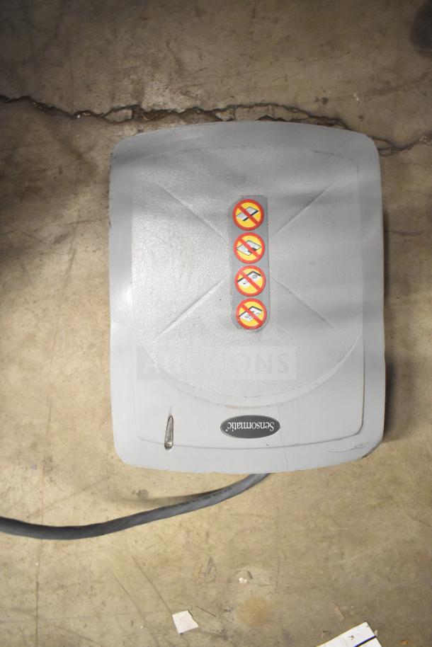Sensormatic ZBSMPROE Antenna Deactivator, gray, with warning stickers; cable attached, displayed on concrete floor.