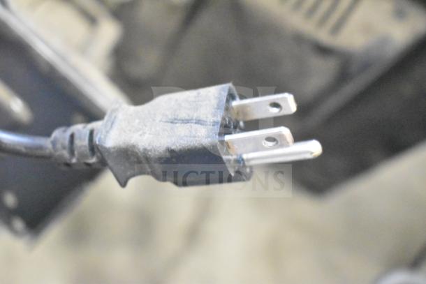 "Lot of various items including a gray electrical plug; includes Vizio SV510XW-0906 Subwoofer, Sensormatic ZBSMPROE Antenna Deactivator."