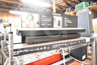 Samsung display with sound bar, models B63M and B53M. Features Dolby Audio, built-in center speaker. Good condition.